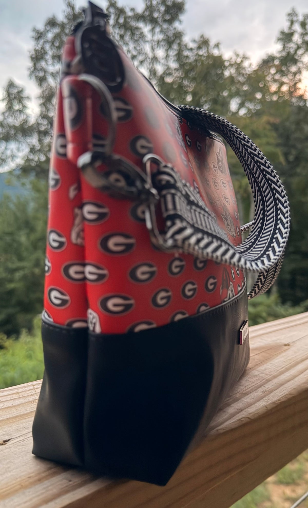 Alyssa XL Crossbody Bag featuring a vibrant Georgia logo design with black bottom and stylish strap.