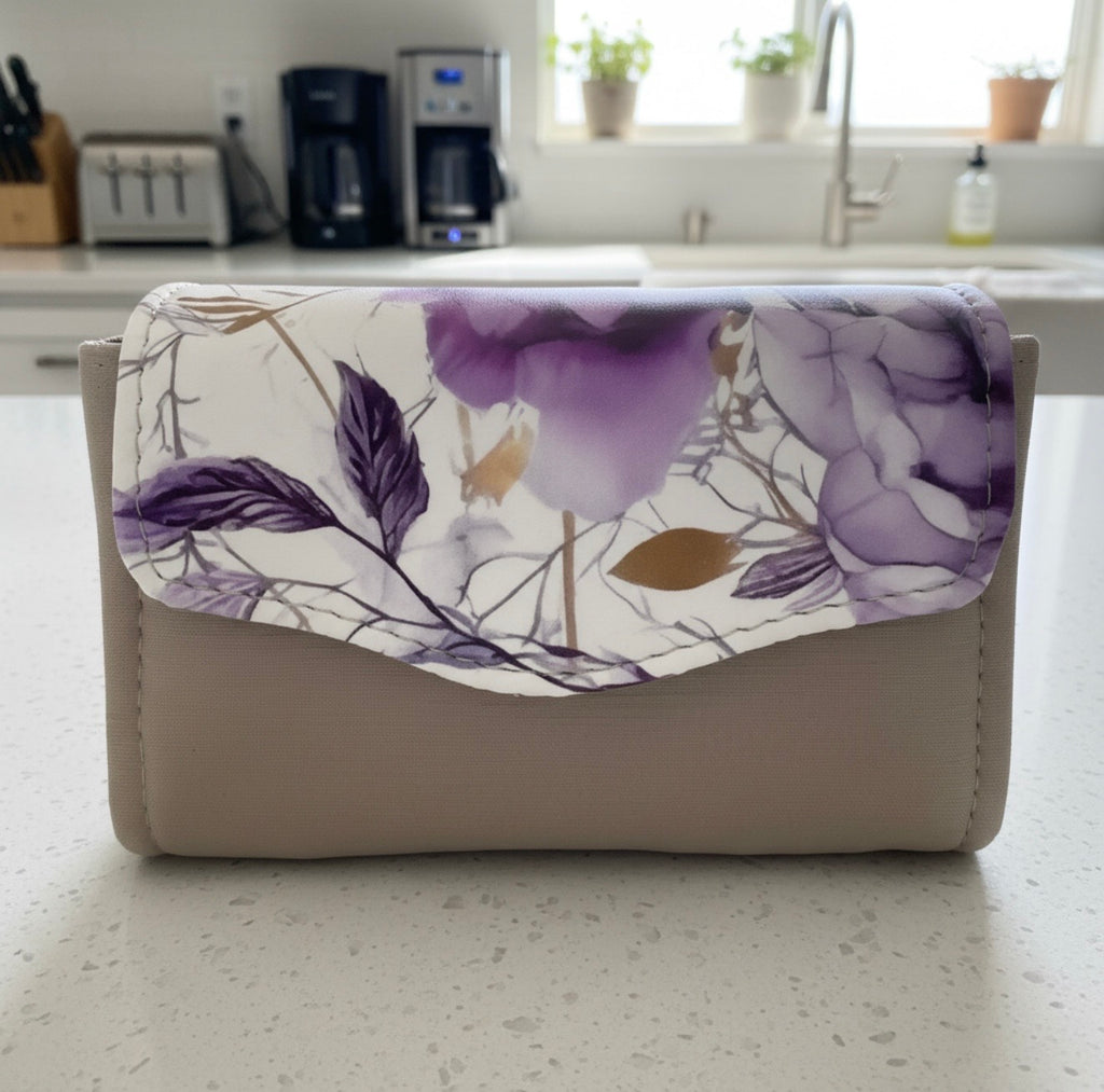 Custom Mini NCW Wallet in elegant floral design on a stylish countertop setting.